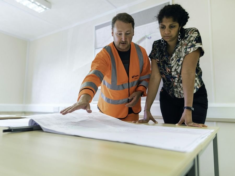 Site engineers reviewing project drawings
